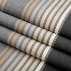 four different shades of grey and beige striped fabric on top of each other in rows