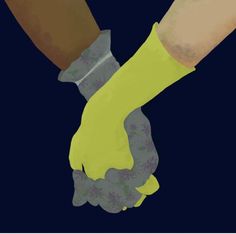 two hands holding each other with yellow gloves on their arms and one hand in the other