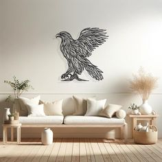 a living room filled with furniture and a large eagle wall decal