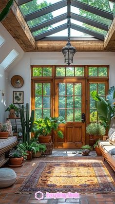 a living room filled with furniture and lots of plants