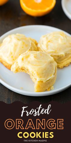 frosted orange cookies on a white plate with an orange in the background and text overlay