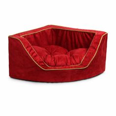 a red dog bed with gold trimmings