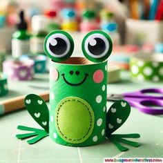 a paper roll frog sitting on top of a table