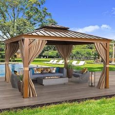 a gazebo sitting on top of a wooden deck next to a swimming pool