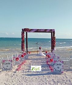 an outdoor ceremony set up on the beach