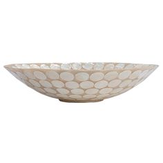 a white bowl with dots on it