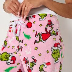 # Pieces In Set: 1 PairFeatures: Adjustable WaistCharacter: GrinchClosure Type: Full Elastic, DrawstringApparel Length: 41 InchesFiber Content: 100% PolyesterFabric Description: MicrofleeceInseam: 31 InCare: Machine Wash, Tumble DryCountry of Origin: Imported Plush Pj Pants, Grinch Christmas Pjs, Grinch Pj Pants, Grinch Pajama Pants, Fluffy Pj Pants, Grinch Pattern, Pink Grinch, Grinch Pajamas, Grinch Stuff