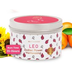 an orange and sunflowers are next to a tin of lip bale cream