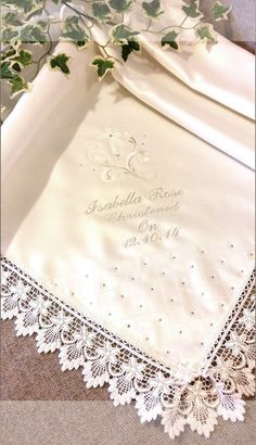 an embroidered wedding handkerchief with ivy on it