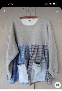 a gray sweater with blue and white checkered pockets