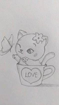 a drawing of a cat sitting in a cup with the word love written on it