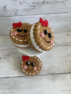 three decorated cookies on top of each other