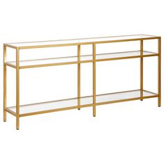 a gold metal and glass console table with shelves on each side, against a white background