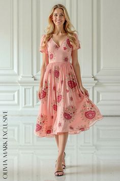 Olivia Mark - Elegant Blush Pink Midi Dress with Floral Pattern and Short Sleeves Chic Pink Floral V-neck Dress, Blush Pink Midi Dress, Pink A-line Printed Midi Dress, Pink V-neck Midi Dress With Floral Print, Pink Floral Print Knee-length Puff Sleeve Dress, Luxury Pink Midi-length Floral Dress, Spring Breeze, Pink Canvas, Flowing Skirt