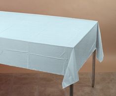 a table with a white cloth draped over it