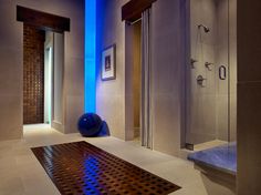 a bathroom with a blue light on the wall