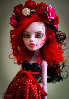 a doll with red hair and flowers on her head