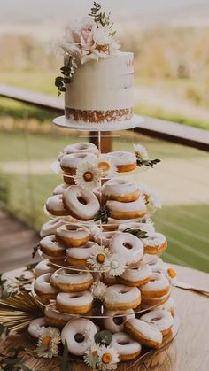 a wedding cake made out of donuts and flowers