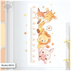 a baby's growth chart wall sticker with giraffes and pigs