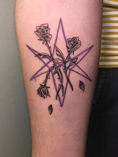 a tattoo on the arm of a woman with flowers and triangles in it, all done by me