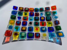 a colorful glass mosaic sitting on top of a table