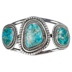 A fine Navajo silver and turquoise cuff bracelet. Set with 3 turquoise cabochons. Simply a wonderful piece of Old Pawn silver! Date: 20th Century Overall Condition: It is in overall good, as-pictured, used estate condition. Condition Details: There are small expected irregularities to all of the turquoise cabochons. Otherwise, there is some light edge wear, some fine and light surface scratches, and other signs of light wear consistent with age. Fineness: Unmarked for fineness. Marks: Unmarked Bracelet Size: ca. 7 1/4 in. Gemstone Measurements: 1- Turquoise: ca. 25mm x 18mm 1- Turquoise: ca. 18mm x 15mm 1- Turquoise: ca. 19mm x 17mm Measurements: Width: ca. 3 in. Depth: ca. 1 7/8 in. Height: ca. 1 3/4 in. Weight: ca. 75 g Items purchased from this dealer must delight you. Purchases may be Turquoise Bracelet Cuff, Turquoise Cuff, Silver Turquoise, Bracelet Sizes, Bracelet Set, Cuff Bracelet, 20th Century, Cuff Bracelets, Jewelry Bracelets