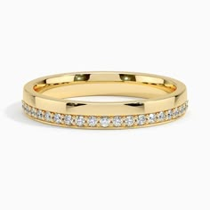 a yellow gold wedding band with diamonds