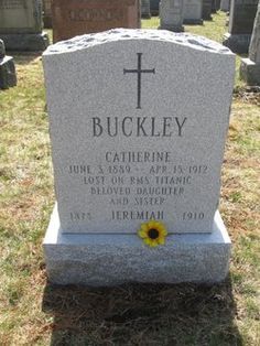 a headstone with a yellow flower on it