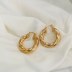 These beautifully twisted hoops are very light and have a modern design. It is made from high-quality metals, making it incredibly durable and comfortable to wear. This piece of jewelry can be combined with all outfits and occasions! We also have a larger size, unless I will leave the list below. Material: 18k Gold Filled -Size: 35 x 7mm  -Perfect for all time. -High-quality Hoops!  Related Items: https://www.etsy.com/listing/1056176244/twisted-hoop-earrings-18k-gold-filled?click_key=9bdde743b5d Hoop Earrings Medium, Earrings Gold Hoops, Twist Hoop Earrings, Earrings Gold Hoop, Thick Hoop Earrings, Twisted Hoop Earrings, Medium Hoop Earrings, Hoop Earrings Gold