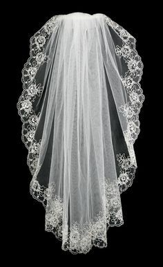 a white veil with flowers on it