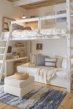 a white bunk bed sitting in a bedroom next to a blue and white rug on top of a wooden floor