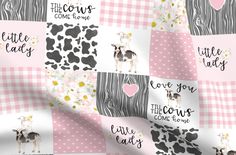 a pink and white checkered fabric with cow designs on it, including the words love you