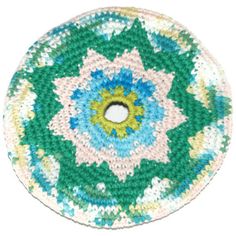 a crocheted plate with a circular design on the center and bottom, in multicolors