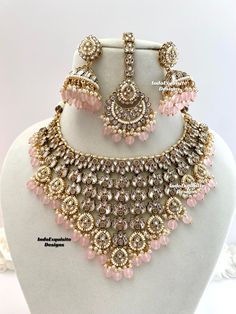 Premium quality Kundan Necklace comes with Jhumki Earrings and Tikka/ Indian Jewelry/Premium Quality Polki and Kundan Jewelry/Pink   All items are shipped from Brampton, Ontario, Canada. If you need your item by a certain day, please reach out to us for express delivery option before placing the order so that we can update the shipping for you. Standard shipping/delivery timeline Below are the delivery timeline estimates. We dispatch all orders by the next business day. ---> USA delivery timeline * 3-5 business days to major urban centers in USA. It may take 1-2 days extra to remote locations ---> Canada delivery timeline  * 2-3 business days - GTA  & Montreal  * 2-4  business days - Rest of Ontario/Quebec * 2-6 business days-  Rest of Canada    ---> Europe/Middle East timeline * 5-10 busi Luxury Pink Kundan Choli, Luxury Pink Bridal Necklace For Festivals, Luxury Pink Stone Work Bridal Necklace, Necklace Set For Pink Lehenga, Nikkah Pink Jewelry, Pakistani Bridal Jewelry Pink, Luxury Pink Bridal Necklace With Stone Work, Luxury Pink Temple Jewelry, Luxury Pink Cutdana Jewelry