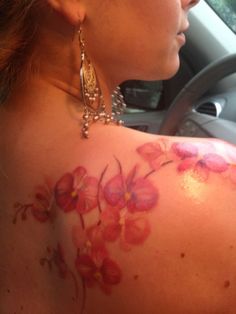 a woman with flowers painted on her back