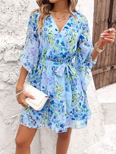 Flirty, flowy, and fabulously femme, our Sienna Floral Wrap Mini Dress is a must-have for any fashion-forward babe. Made with lightweight chiffon fabrication, this dress will keep you cool and chic all season long. Embrace your inner flower child with this playful and versatile piece. Size Guide: Model is 5’8” tall, and has a 33.4” bust, 26.4” waist, & 35.4” hips. She is wearing a S / US 4 / AU 8. This dress is true to size. Material: 100% Polyester. Feature: V-Neckline. Wrap front with waist tie. Short ruffle sleeves. Floral Print. Chiffon Fabrication. Mini length. Care Instructions: Machine wash / Cold hand wash Blue Flowy A-line Dress, Chiffon A-line Beach Dress, Flowy A-line Breezy Dress, Flowy Summer Casual Chiffon Dress, Casual Summer Flowy Chiffon Dress, Summer Casual Flowy Chiffon Dress, Spring Chiffon Beach Dress, Breezy A-line Spring Dress, Chic A-line Chiffon Dress For Beach