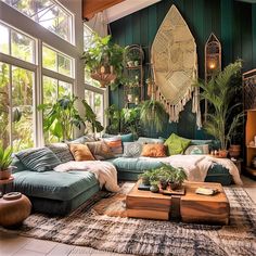 a living room filled with lots of green plants and potted plants on the wall