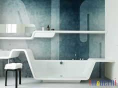 a white bath tub sitting next to a sink under a bathroom mirror with shelves above it