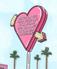 a pink heart shaped lollipop with words written on it and palm trees in the background