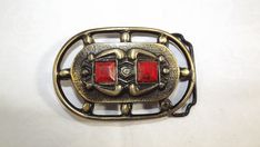 This is quite a striking buckle!  It features a raised symbolic frog and square cabochons.  It is marked with a sticker on the back: 1032 Please zoom in on all pictures Excellent condition~ no issues Wear with a 1 7/8" belt Measures 3 1/2" wide by 2 1/4" tall.  Add an intriguing flair to your vintage wardrobe! Enjoy! *Orders to the USA and Canada will include tracking for this item. Thanks for checking out the rest of my shop for other interesting Etsy treasures! Multiple purchases get great dea Vintage Wardrobe, Zip Code, Suspenders, All Pictures, Buckle, Thing 1