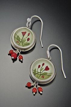 Round Poppy Earrings by Ananda Khalsa. A bright burst of red color wonderfully contrasts sterling silver in both the hand-painted acrylic image and coral beads of these enticing earrings. Red Round Enamel Earrings, Artsy Red Dangle Jewelry, Red Enamel Round Earrings, Artistic Red Enamel Jewelry, Red Artsy Drop Earrings, Artsy Red Nickel-free Earrings, Handmade Artsy Red Jewelry, Red Hand Painted Sterling Silver Jewelry, Artistic Red Earrings For Gifts