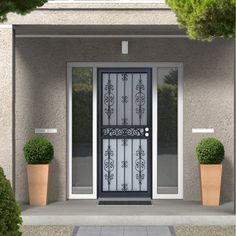 the front door is decorated with potted plants