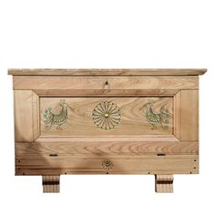 the chest is made out of wood and has decorative designs on it