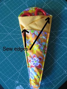 an origami umbrella is shown with the arrow pointing to it's center