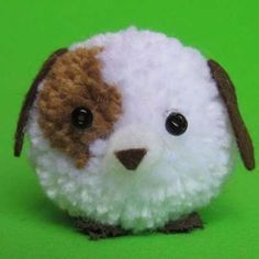 a small stuffed animal on a green background