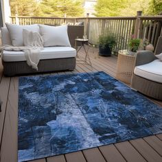 a blue area rug on a wooden deck