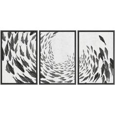 three black and white paintings with fish in the water, each one being framed on a wall