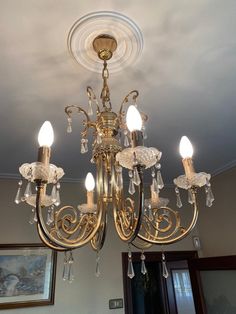 a chandelier hanging from the ceiling in a room