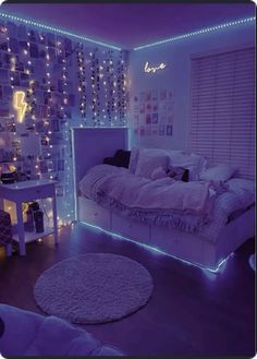 a bedroom decorated in purple and white with lights on the walls, bedding and rugs