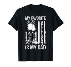 a black t - shirt with an american flag and boots saying my favorite veteran is my dad